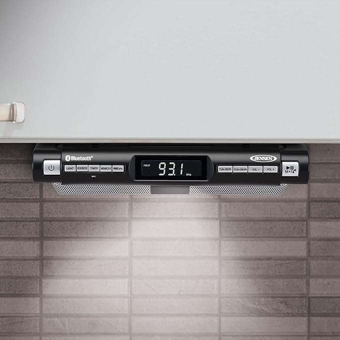 Jensen Modern Wireless Under Cabinet Kitchen Universal Bluetooth Music System, FM Radio, Clock LCD Digital Display , Built-in Hands-free Mic & Speakers (Includes Mounting Hardware)