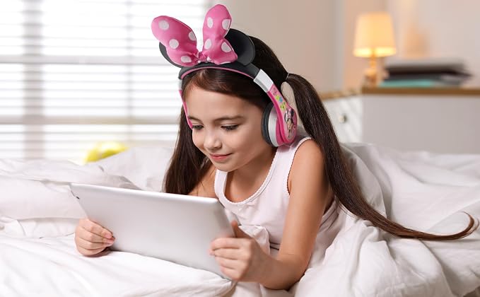 eKids Minnie Mouse Kids Bluetooth Headphones, Wireless with Microphone Includes Aux Cord, Volume Reduced Foldable Headphones for School, Home, or Travel, Pink